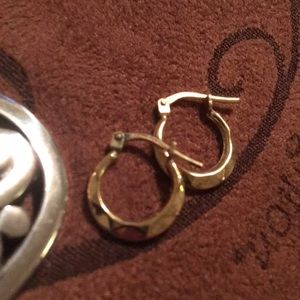 Real gold hoop earrings. They are a small